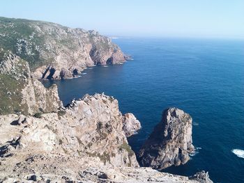 Scenic view of sea with mountains in background