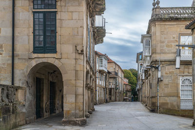 Alley amidst buildings in city