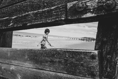 Boy framed on beach