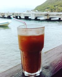 Close-up of water in lake against sky