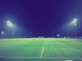 View of illuminated park at night