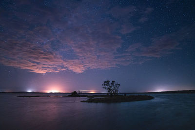 Scenic view of sea against sky at night