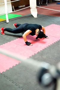 Real woman on boxing training doing push ups