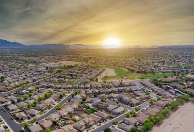 High angle view of cityscape against sky during sunset