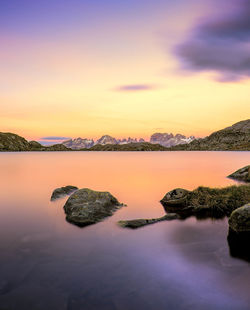 Scenic view of lake against sky during sunset