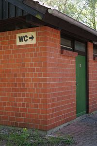 Text on brick wall of building