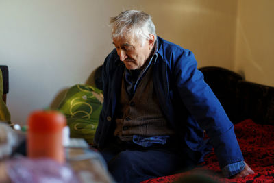 Senior man sitting at home