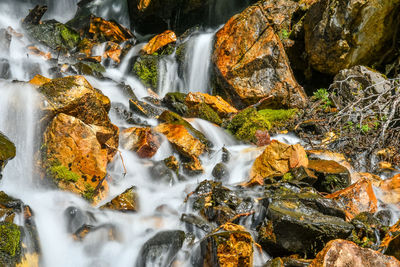 View of waterfall along rocks