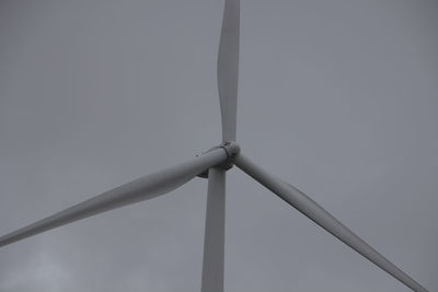 Low angle view of wind turbine against sky