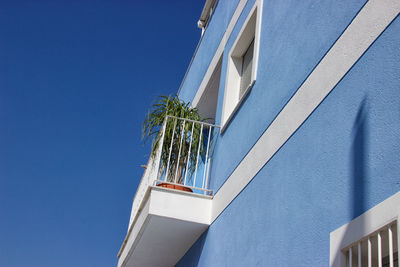 Low angle view of building against blue sky