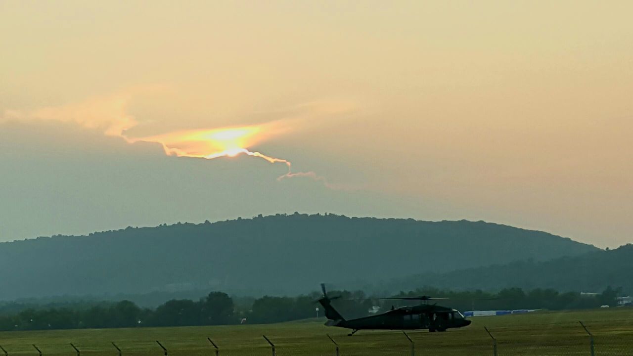 landscape, mountain, sunset, transportation, scenics, mode of transport, sky, flying, beauty in nature, tranquil scene, air vehicle, airplane, nature, mountain range, tranquility, weather, cloud - sky, travel, field, outdoors