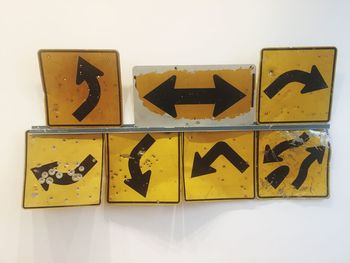 Close-up of yellow arrow sign