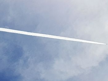 Low angle view of vapor trail against sky