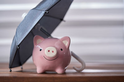 Close-up of piggy bank on table