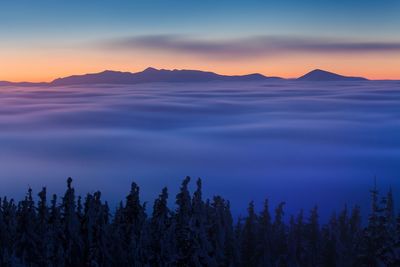 Scenic view of mountains against sky during sunset
