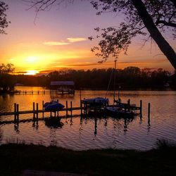 Scenic view of calm lake at sunset