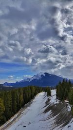 Scenic view of landscape against sky during winter