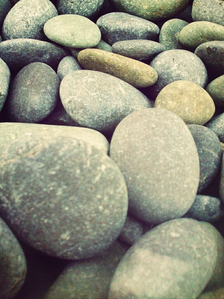 large group of objects, abundance, full frame, backgrounds, pebble, stone - object, textured, stack, close-up, heap, still life, no people, high angle view, repetition, stone, pattern, arrangement, detail, day, rock - object