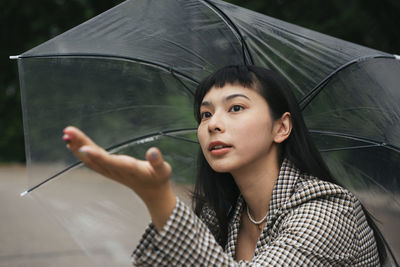 Portrait of young woman looking away