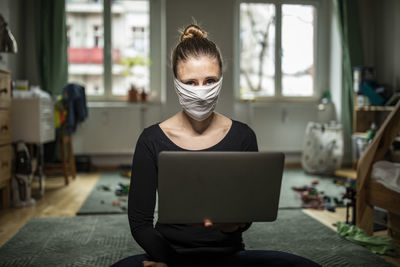 Midsection of woman using mobile phone