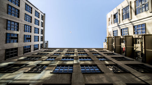 Low angle view of buildings against clear sky