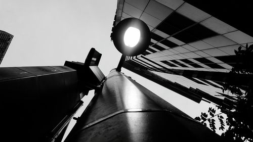 Low angle view of illuminated lighting equipment in building