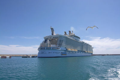 Ship in sea against blue sky