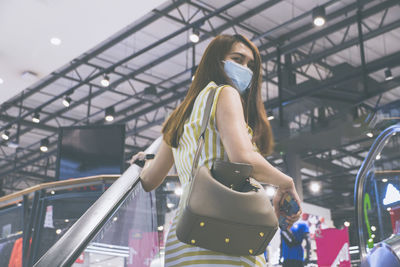 Woman standing in amusement park