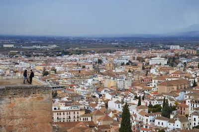 High angle view of buildings in city against sky