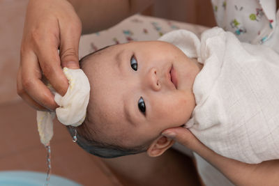 Close-up portrait of cute baby lying