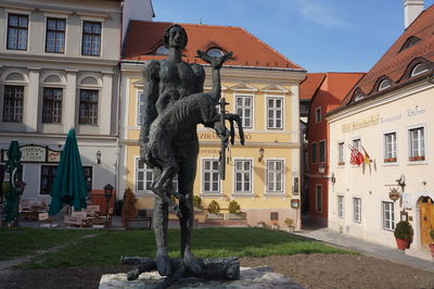 Statues against building