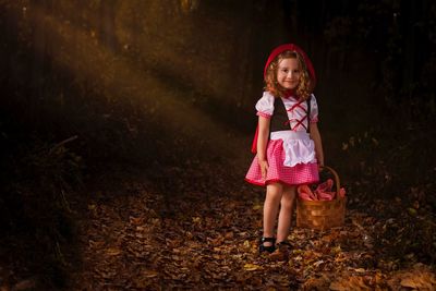 Full length of cute girl standing outdoors