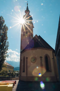 Low angle view of bell tower against sky