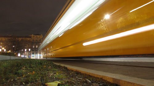 View of illuminated road at night