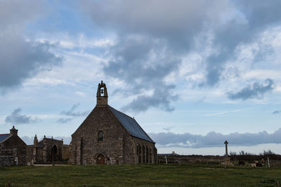 Low angle view of built structures against sky