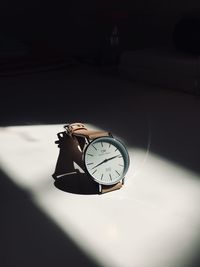Close-up of clock on table