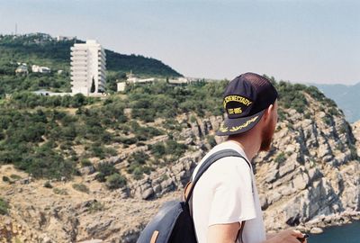 Man standing on mountain against clear sky