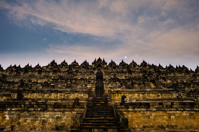 Low angle view of borobudur against sky during sunset