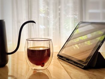 Close-up of beer glass on table