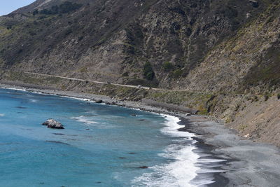 High angle view of rocks on sea