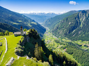 Scenic view of landscape and mountains against sky