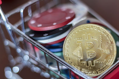 Gambling chips and a bitcoin in a trolley