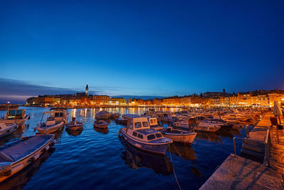 Boats moored at harbor