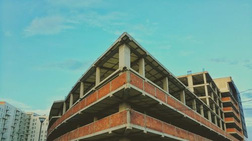 Low angle view of built structure against blue sky