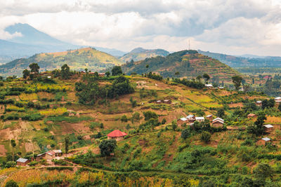 Scenic view of african landscape with mount muhabura in the background at kisoro, uganda