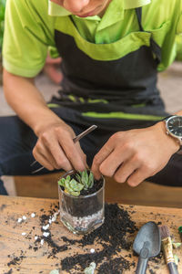 Midsection of man preparing food on table