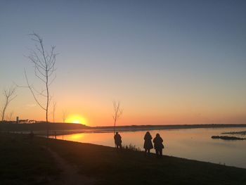 Scenic view of lake during sunset