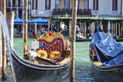 Cropped image of gondolas moored at harbor