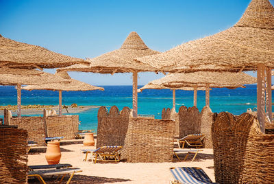 Panoramic view of beach against clear blue sky