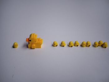High angle view of rubber duck toys against gray background